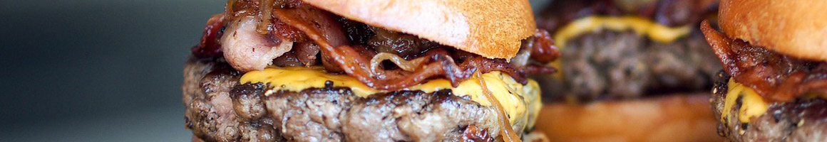 Eating Burger Greek at Hell's Kitchen restaurant in North Babylon, NY.